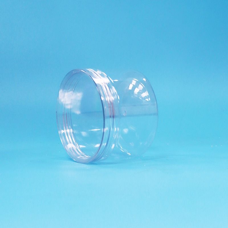 Tarro de plástico PET cilíndrico transparente de fácil apertura con tapa de rosca para frutos secos, caramelos y galletas