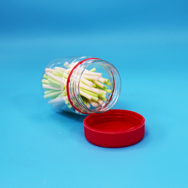 Grado alimenticio de tornillo tapa roja vacía plástico pequeño transparente PET dulce tarros de almacenamiento para la venta