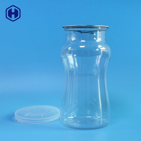 El plástico transparente fino de la pared conserva los envases de plástico cilíndricos ligeros