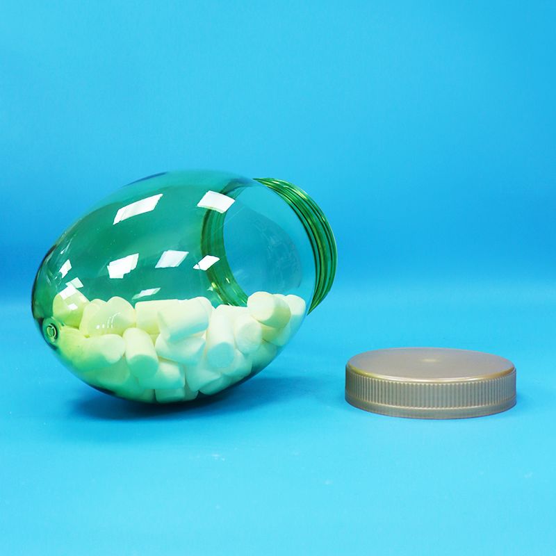 Tarro de plástico transparente PET de forma única para alimentos, grado alimenticio, con tapa plana de rosca para nueces, pistachos y caramelos